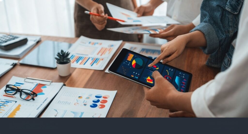 Startup portfolio team reviewing metrics and reports